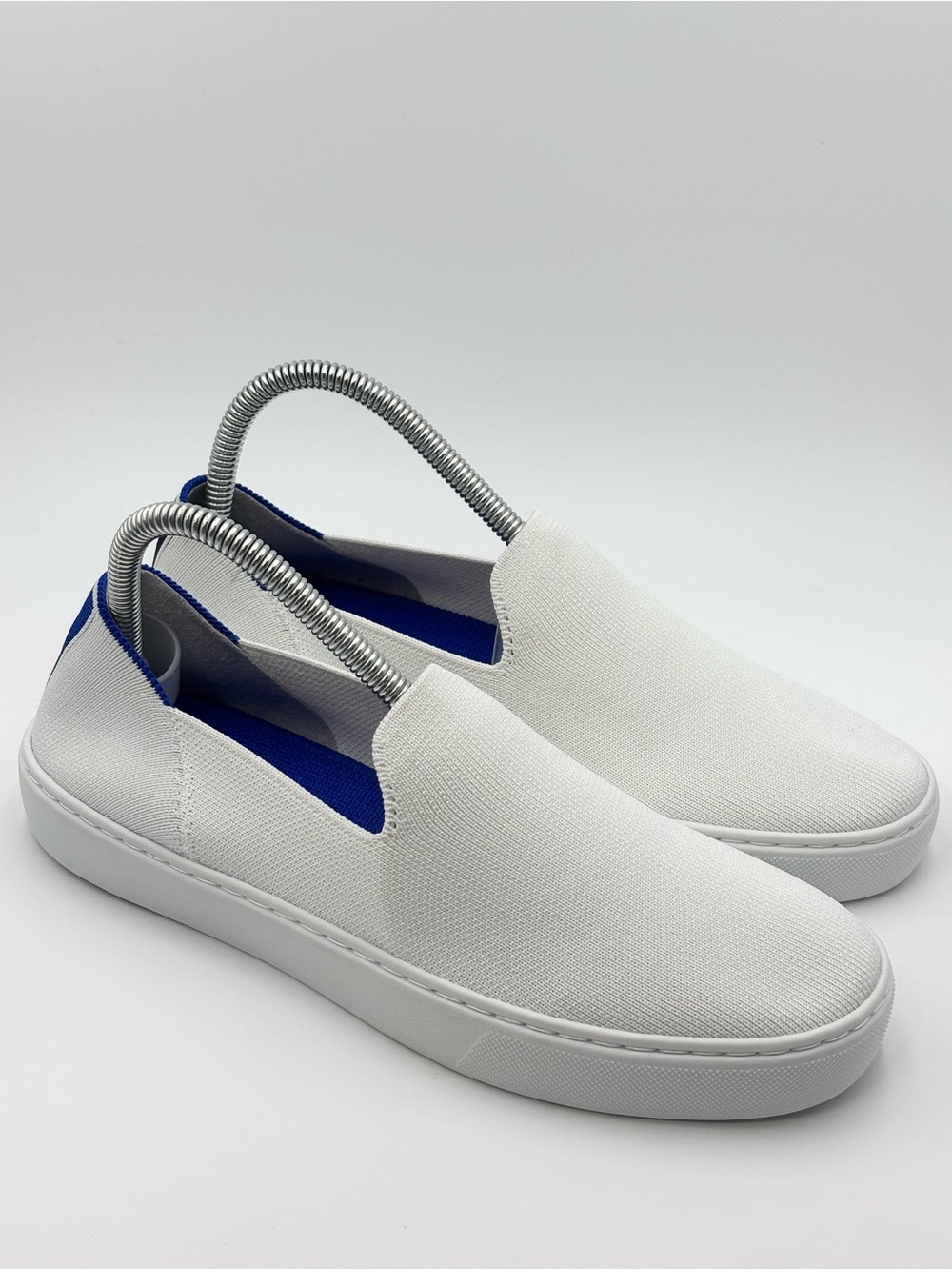 Rothy's White Slip-On Flats with Royal Blue Accent